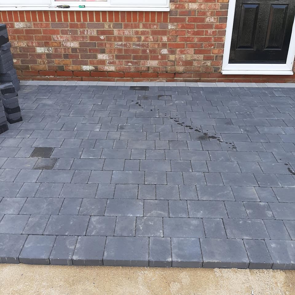 block driveway at front of house half complete