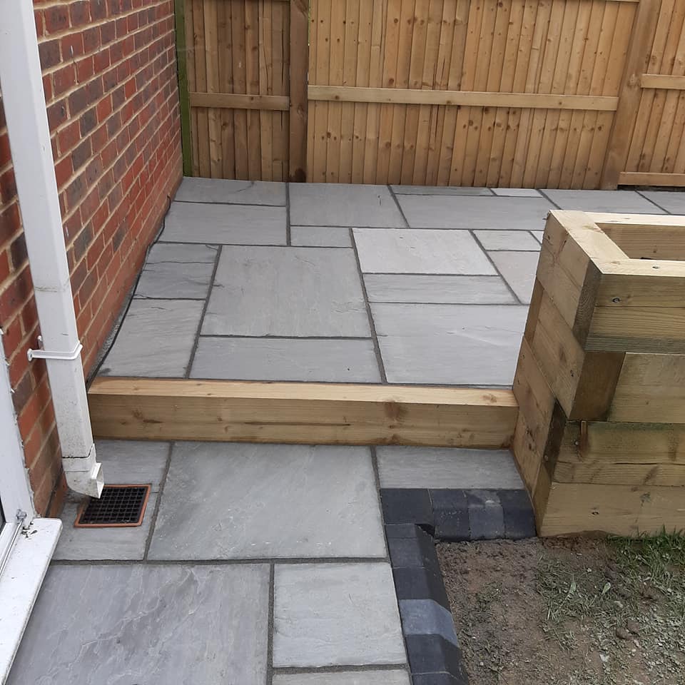 patio slabs with fence